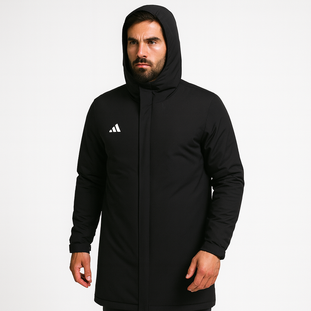 Person wearing a black Adidas coat on a white background