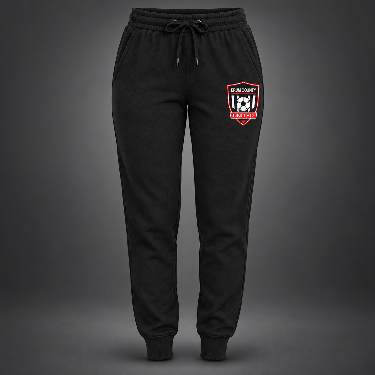 Black women's cuffed joggers with the red, black, and white Krum County United crest on the left thigh.
