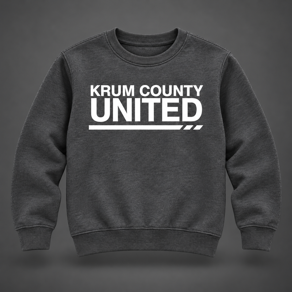 Charcoal youth crewneck sweatshirt with white Krum County United lettering and a thin segmented underline.