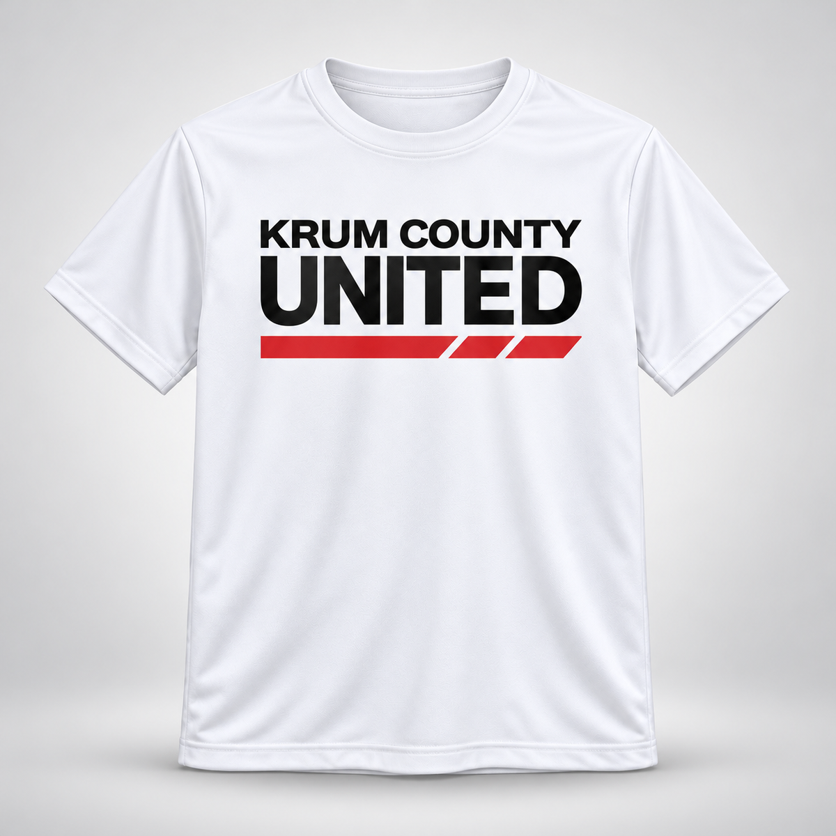 White youth athletic-style T-shirt with black Krum County United lettering and a red segmented underline.